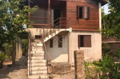 Casa com 4 quartos à venda na Rua Marquês do Maricá, 134, Vila Nova, Porto Alegre
