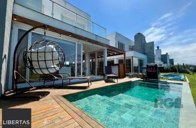 Casa em condomínio fechado com 4 quartos à venda na Avenida Jaçanã, 1100, Atlântida, Xangri-Lá