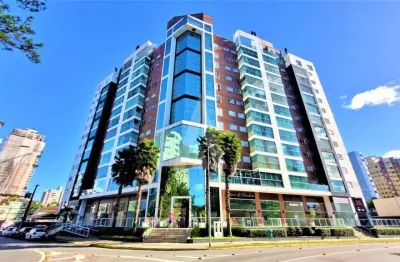 Apartamento no bairro atiradores com 3 quartos, cozinha com armários, sacada, churrasqueira interna e vaga de garagem dupla.