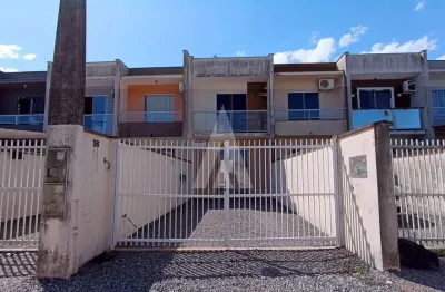 Geminado no bairro iririú com 2 quartos, sala de estar e jantar integradas, cozinha e 1 vaga de garagem.