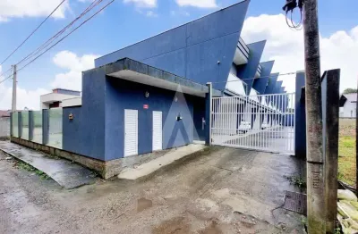 Geminado com 3 dormitórios, sendo 1 suíte, 1 banheiro social e portão eletrônico em Araquari