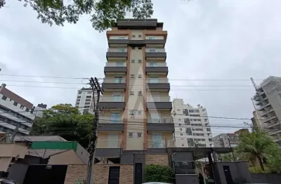 Apartamento semi mobiliado no bairro Atiradores, com 3 quartos sendo 1 suíte, cozinha com armários e vaga dupla de garagem.