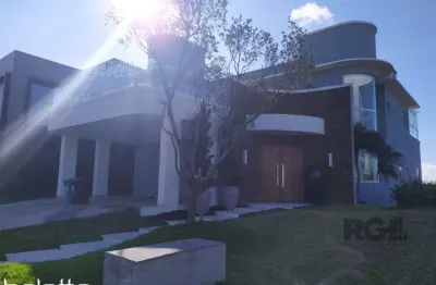 Linda casa para comprar , mobiliada ,com 3 suítes no condomínio ponta da figueir