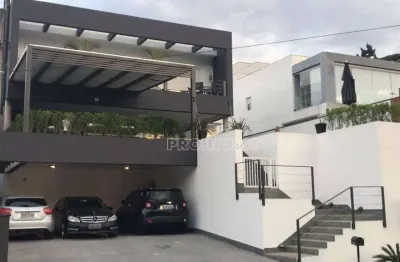 Casa com 4 dormitórios, 420 m² - venda por R$ 3.300.000,00 ou aluguel por R$ 18.000,00/mês - Golf Village - Carapicuíba/SP