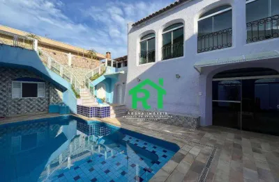 Casa à beira mar com 4 dormitórios (2 suítes), 3 vagas, lazer, balneário praia do pernambuco, guarujá/sp