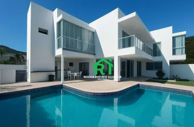 Casa à beira mar com 4 quartos (4 suítes), 6 vagas e lazer à venda em jardim guaiuba, guarujá