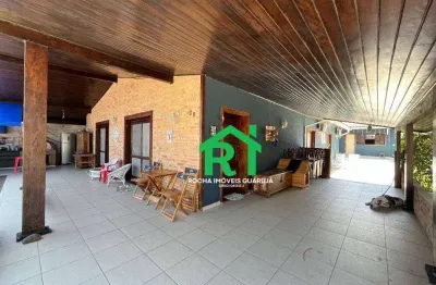 Casa à beira mar com 7 quartos (7 suítes), 4 vagas e lazer à venda em Enseada, Guarujá