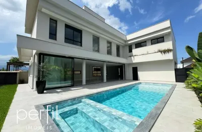 Sobrado a venda em condomínio fechado com 4 suítes e piscina no bairro pirabeiraba - joinville/ sc