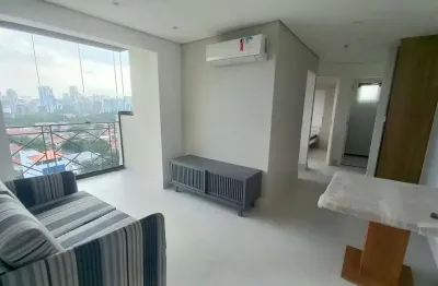 Apartamento tipo flat  mobiliado e equipado com 52m² para locação com 2 dormitórios varanda e 1 vag