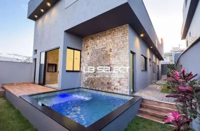 Casa no condomínio terras alpha com três quartos e varanda gourmet.