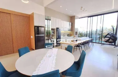 Casa no condomínio alphaville ii com quatro suítes e área gourmet.