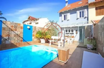 Casa em condomínio fechado com 4 quartos à venda na rua antonio delapieve, 420, mário quintana, porto alegre por r$ 740.000