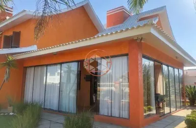 Casa em condomínio fechado com 5 quartos à venda na das orquídeas, 124, capão novo, capão da canoa por r$ 1.804.000
