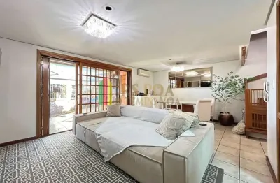 Casa em condomínio fechado com 3 quartos à venda na Avenida Coronel Marcos, 2171, Pedra Redonda, Porto Alegre por R$ 630.000