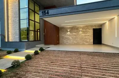 Casa térrea com 3 suítes, 4 vagas, salas integradas, área gourmet, piscina no condomínio splêndido em uberlândia, zona sul.