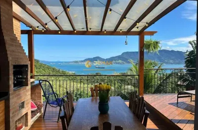 Casa em condomínio fechado com 4 quartos à venda na rua da padroeira, 1, siriuba, ilhabela por r$ 2.950.000