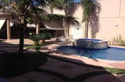 Casa a venda no bairro jardim karaiba com aproximadamente 367m² de área construída, terreno com 669,20 m², 4 suítes, linda área de lazer com piscina