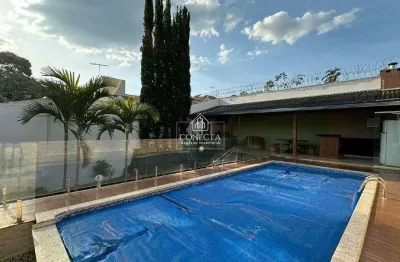 Casa estilo sobrado a venda em uberlândia, cidade jardim, 4 dormitórios, 2 suítes, area de lazer com piscina, churrasqueira, 3 vaga
