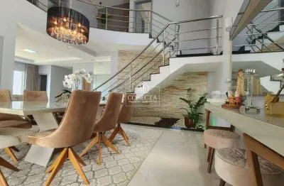 Casa tipo sobrado de esquina no bairro jardim karaiba, 340 m² de área construída, 4 suites, area de lazer completa