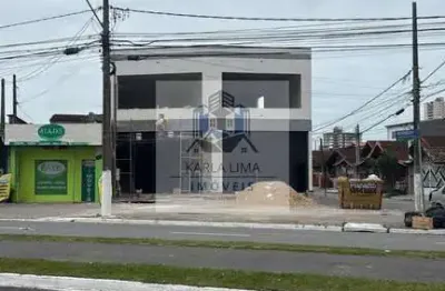 Aluga-se loja / sobreloja com amplo espaço, 02 vagas em maracanã  -  praia grande