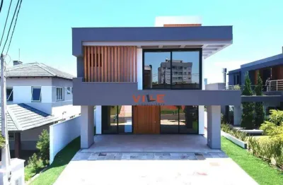 Casa de alto padrão com 300m² de área construída  condomínio alphaville  - gravataí / rs