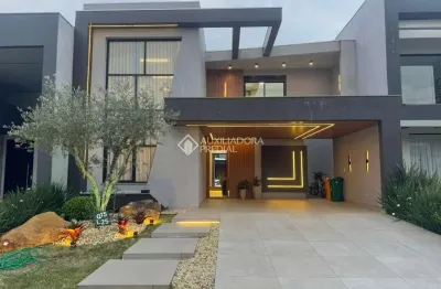 Casa em condomínio fechado com 4 quartos à venda na rua rio novo, 101, centro, xangri-lá, 169 m2 por r$ 2.790.000