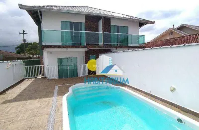 Sobrado poucos metros do mar 03 quartos sendo 02 suites, piscina em guaratuba