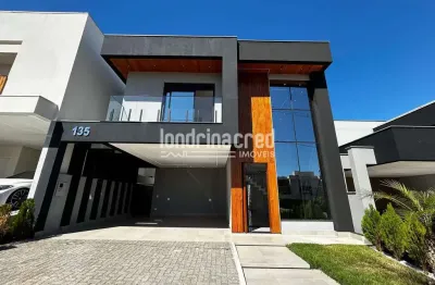 Casa de alto padrão em condomínio na região leste de londrina: 3 suítes, piscina privativa, carrega