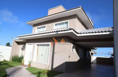 Sobrado triplex com 4 quartos, 3 suítes, 295,72m² no centro de quatro barras.