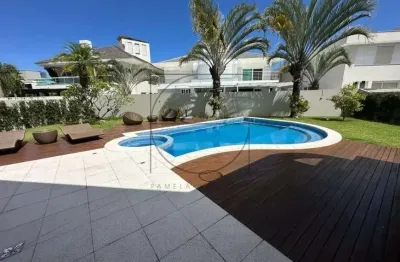 Casa com 5 quartos à venda na rua das caraúnas, 114, jurerê internacional, florianópolis por r$ 7.900.000