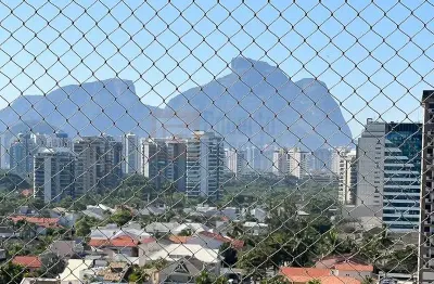 Apartamento vista lateral mar à venda barra da tijuca de  82m² andar alto 2 suítes sala cozinha  2 varandas garagem mobiliado decorado e reformado