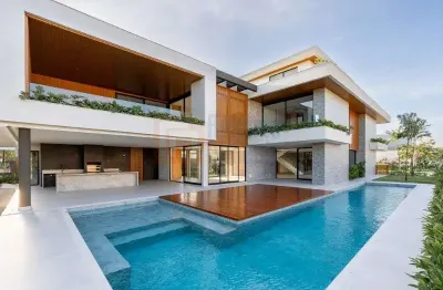 Pronta para morar! magnífica casa à venda condomínio alphaville 995m² área útil terreno de 980m² 5 suítes piscina sauna varanda gourmet churrasqueira