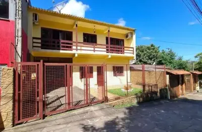 Casa com 4 quartos à venda na Rua Ventos do Sul, 140, Vila Nova, Porto Alegre