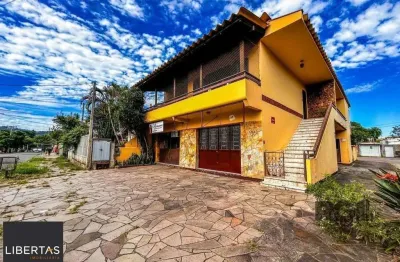 Casa com 2 salas comerciais, 3 quartos, vaga de garagem churrasqueira, suíte, no bairro cavalhada, porto alegre/rs