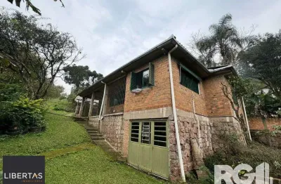 Casa com 3 quartos à venda na Rua dos Canudos, 358, Cascata, Porto Alegre