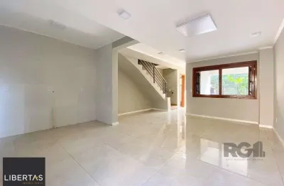 Casa com 3 quartos à venda na Rua Ronaldo Molina de Quadros, 420, Mário Quintana, Porto Alegre