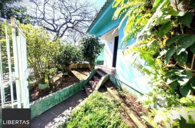 Casa com 4 quartos à venda na Rua Sebastião Wolf, 314, Nonoai, Porto Alegre