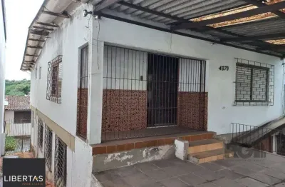 Casa com 3 quartos à venda na Avenida da Cavalhada, 4370, Cavalhada, Porto Alegre