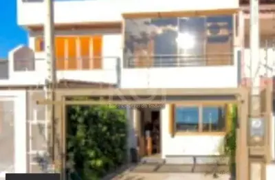Casa com 3 quartos à venda na Rua Waldemar da Silva Tavares, 234, Guarujá, Porto Alegre