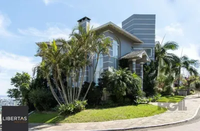 Casa em condomínio fechado com 4 quartos à venda na Rua Alcebíades Antônio dos Santos, 356, Nonoai, Porto Alegre