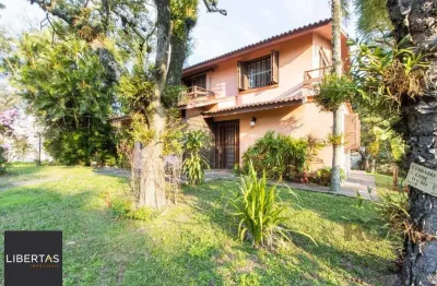 Casa com 4 quartos à venda na Rua Itapitocaí, 725, Cristal, Porto Alegre