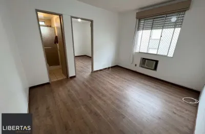 Apartamento de um dormitório no condomínio piratini com uma vaga de garagem escriturada.