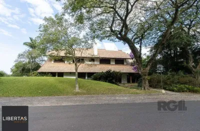 Casa em condomínio fechado com 6 quartos à venda na Avenida da Cavalhada, 5205, Cavalhada, Porto Alegre