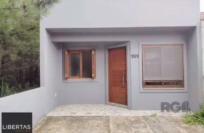 Casa térrea - 2 dormitórios, área coberta com churrasqueira , terraço - 02 vagas