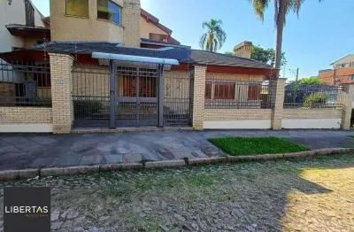 Casa com 4 quartos à venda na Rua Paissandu, 361, Partenon, Porto Alegre