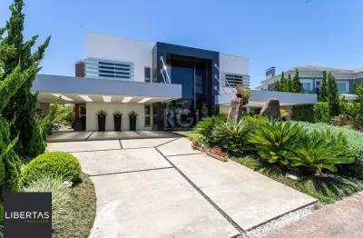 Casa em condomínio fechado com 5 quartos à venda na Avenida Juca Batista, 8000, Belém Novo, Porto Alegre