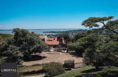 Casa bairro sétimo céu, 463m² privativos, vista privilegiada do rio guaíba em terreno de 1.423m².