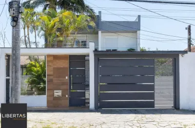 Excelente casa de 3 dormitórios, 3 suítes e 2 vagas no bairro cavalhada.