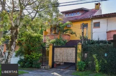 Casa com 3 quartos à venda na Rua Mura, 120, Guarujá, Porto Alegre