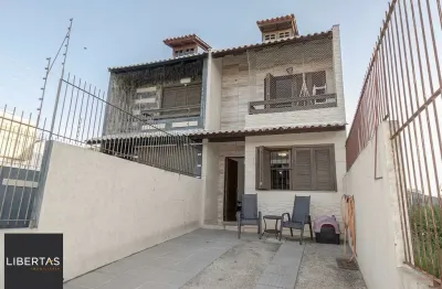 Casa com 3 quartos à venda na Rua Heitor Kramer, 571, Guarujá, Porto Alegre